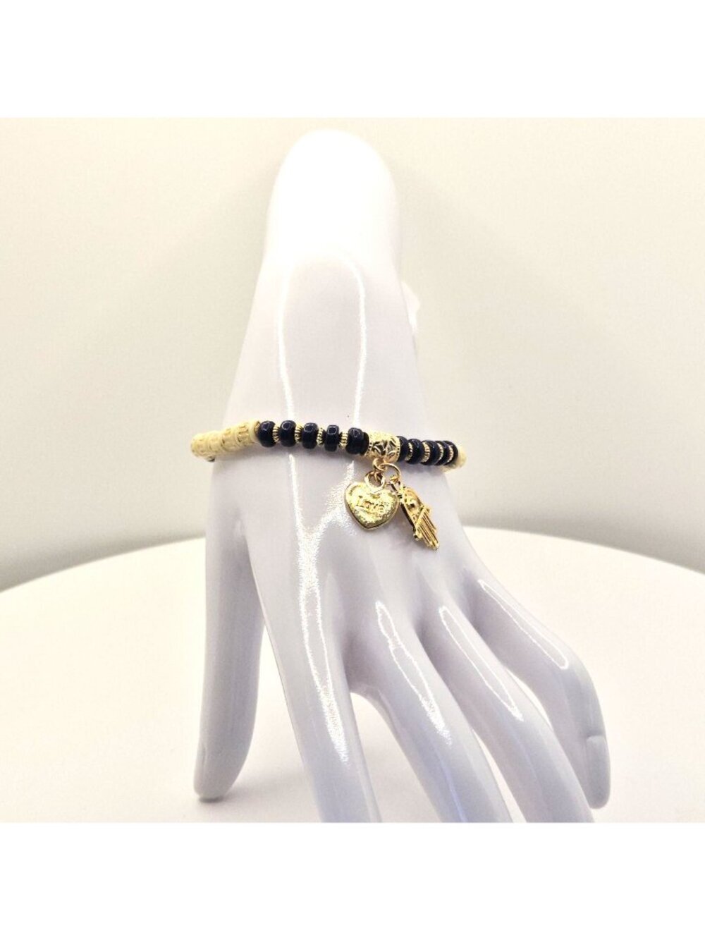 Beaded Stretch Bracelet With A Heart "Love" Pendant And Hamsa Hand Charm